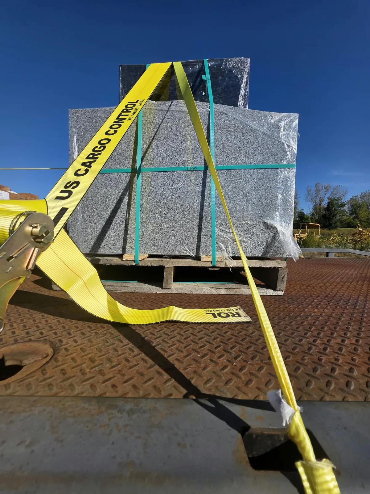 Wrapped granite monuments strapped on the Cardinal flatbed for delivery